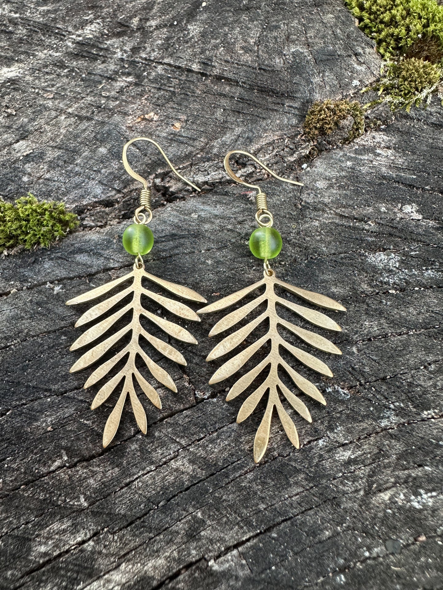 Fern dangle earrings with green sea glass made with sturdy brass, gold color,