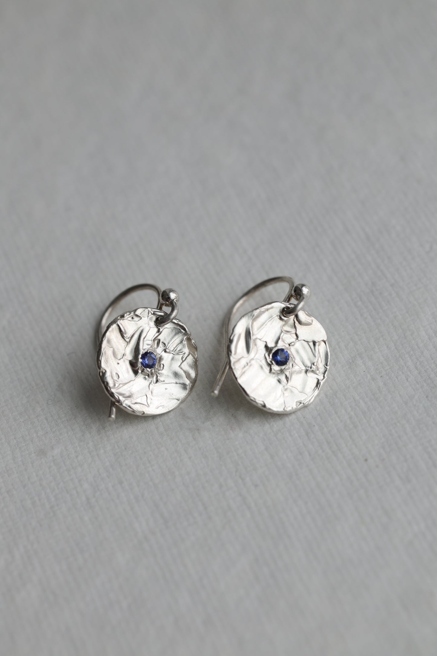 Small one of a kind blue sapphire earrings textured